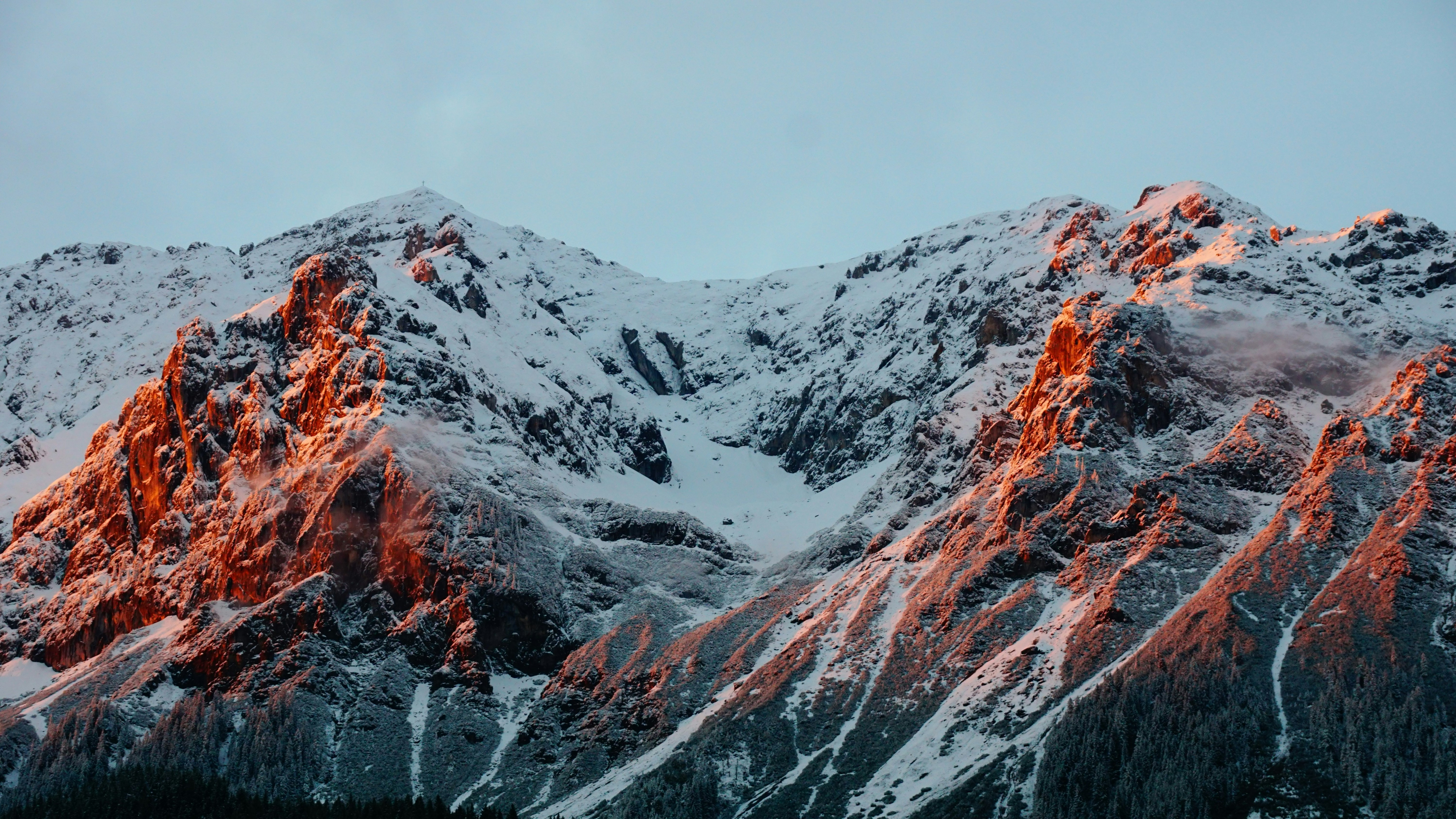 photo of mountain covered of snow during cloudy sky